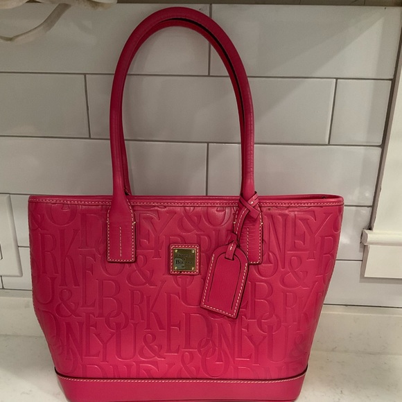 Dooney & Bourke Handbags - **OPEN TO GOOD OFFERS** DOONEY AND BOURKE PINK RETRO EMBOSSED PURSE PINK